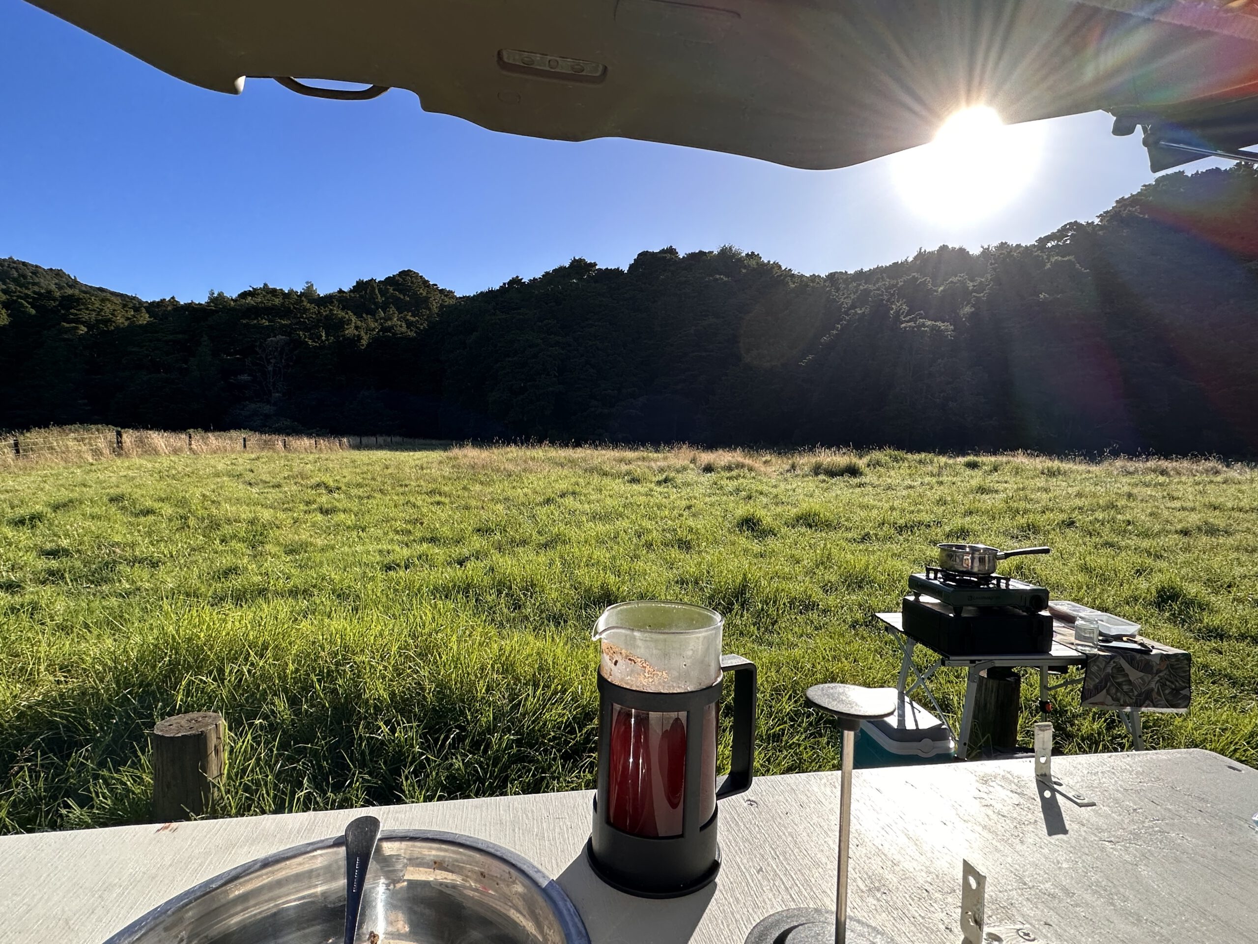 Making a cup of coffee in the back of my campervan in New Zealand