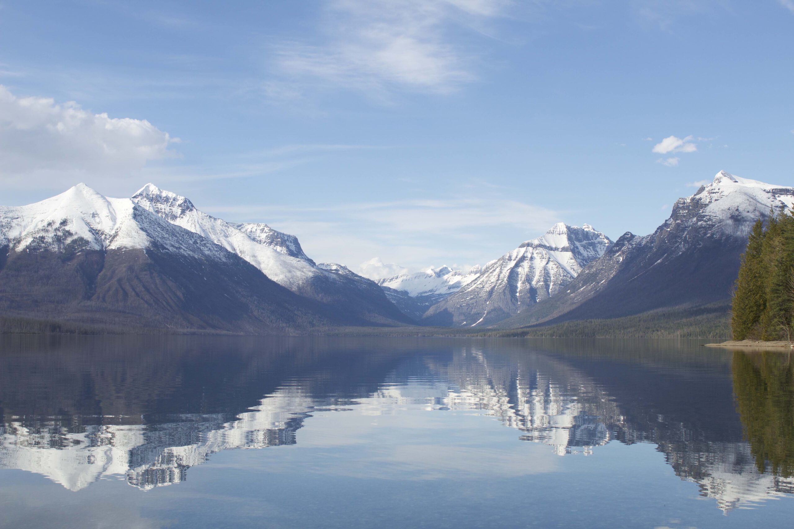 Snow capped mountains above Lake Mcdonald in Glacier National Park