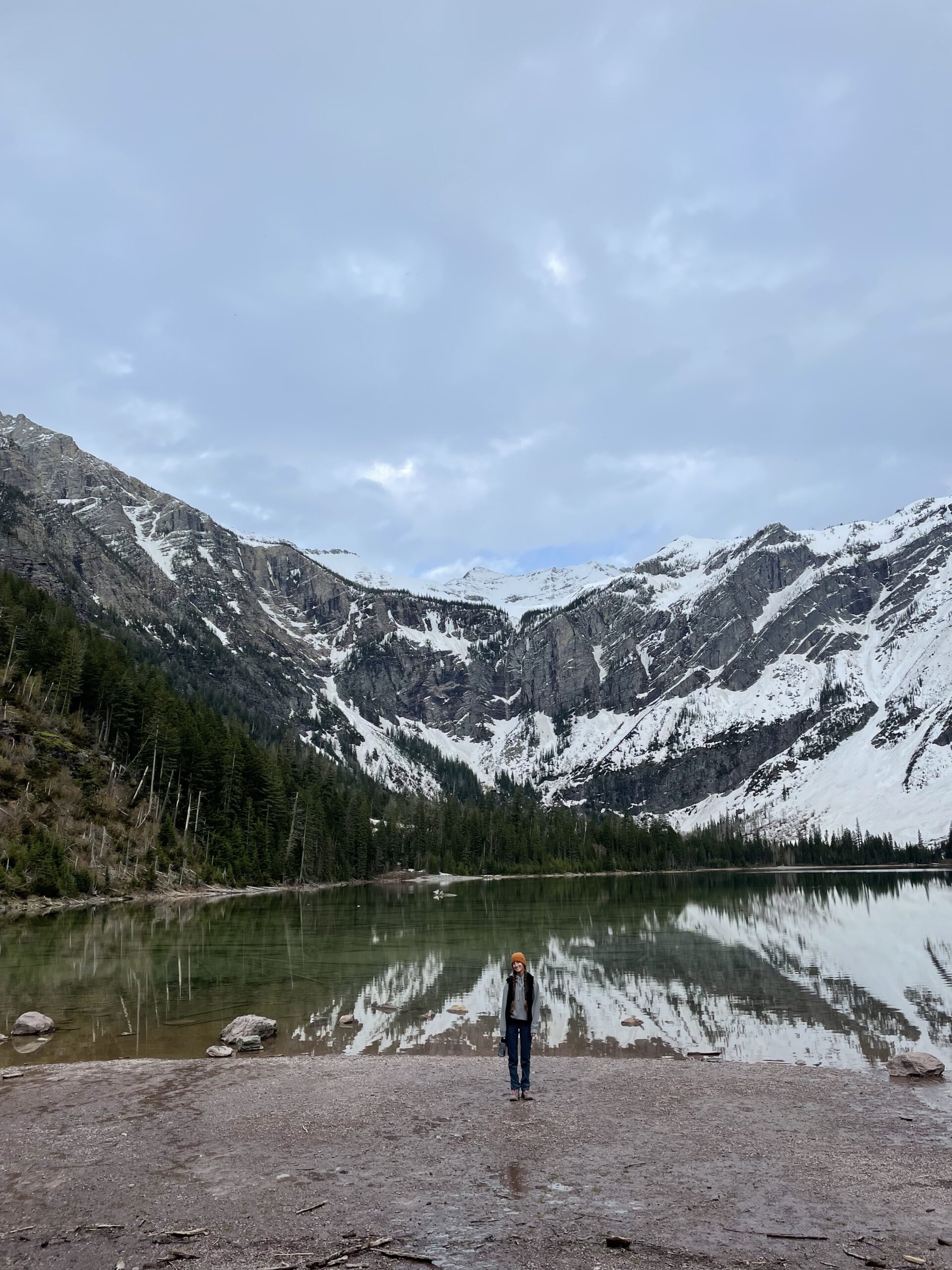 Standing on the edge of Avalanche Lake in Glacier National Park 